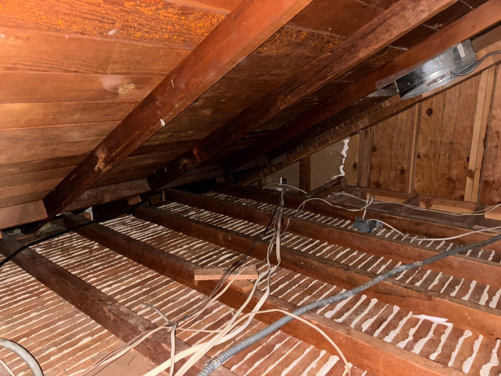 Foam air sealing between ceiling boards in a Agoura Hills attic