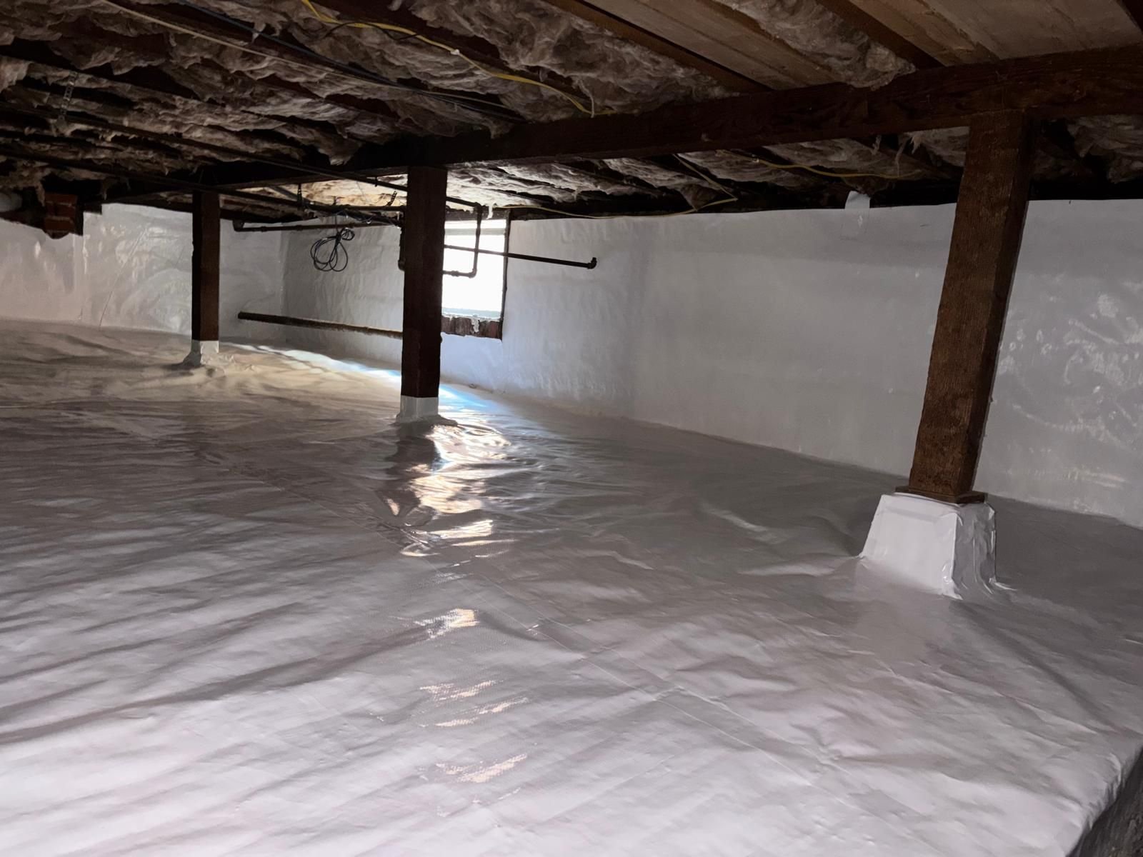 Vapor barrier sealed at the piers and perimeter in a Altadena crawl space