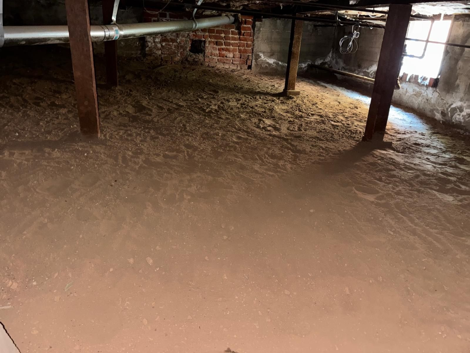 Bare soil floor of a Altadena crawl space before work
