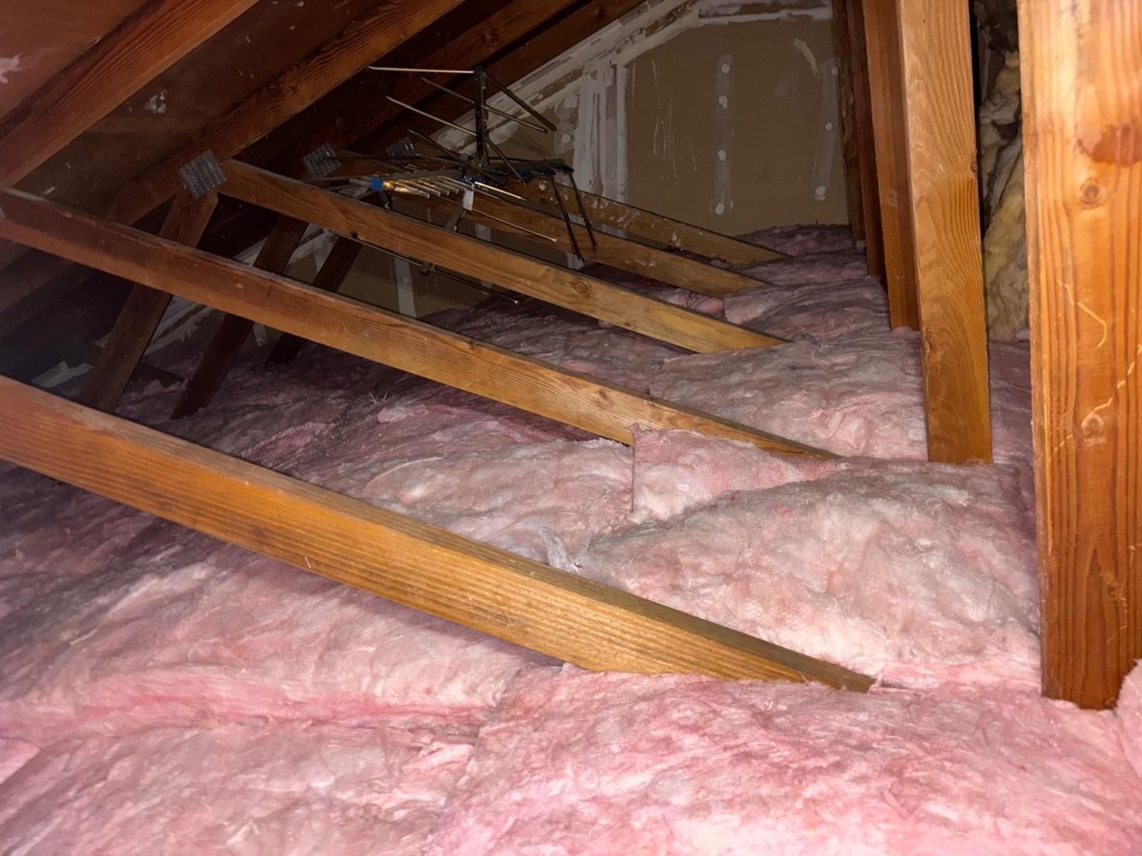 New insulation batts between attic framing in Anaheim