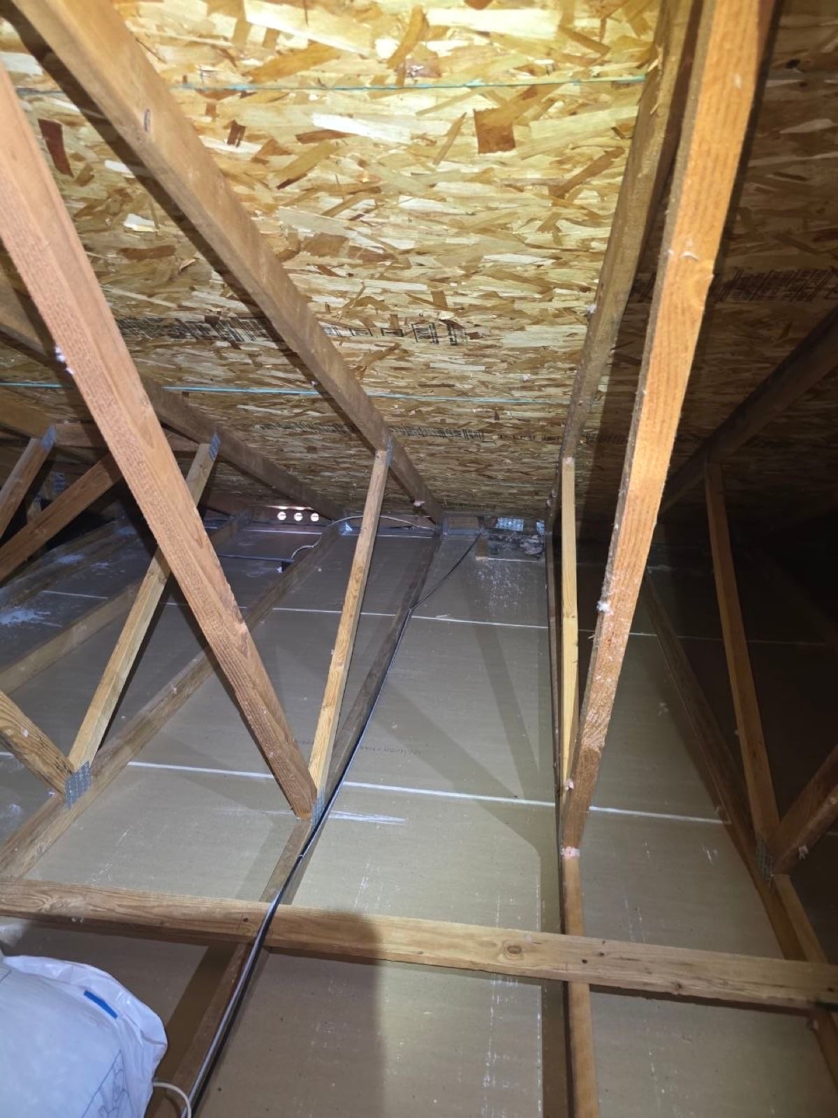 Tracy attic with the new insulation going in