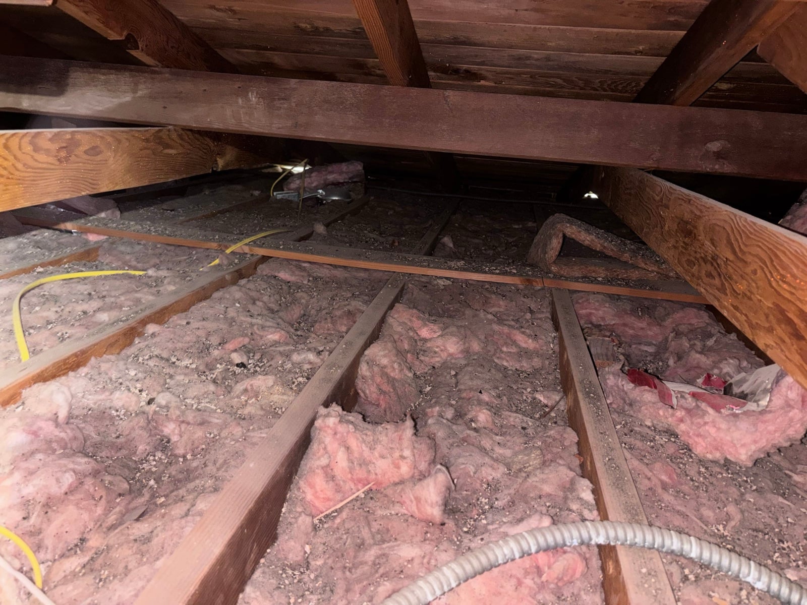 Los Angeles attic with the new insulation going in