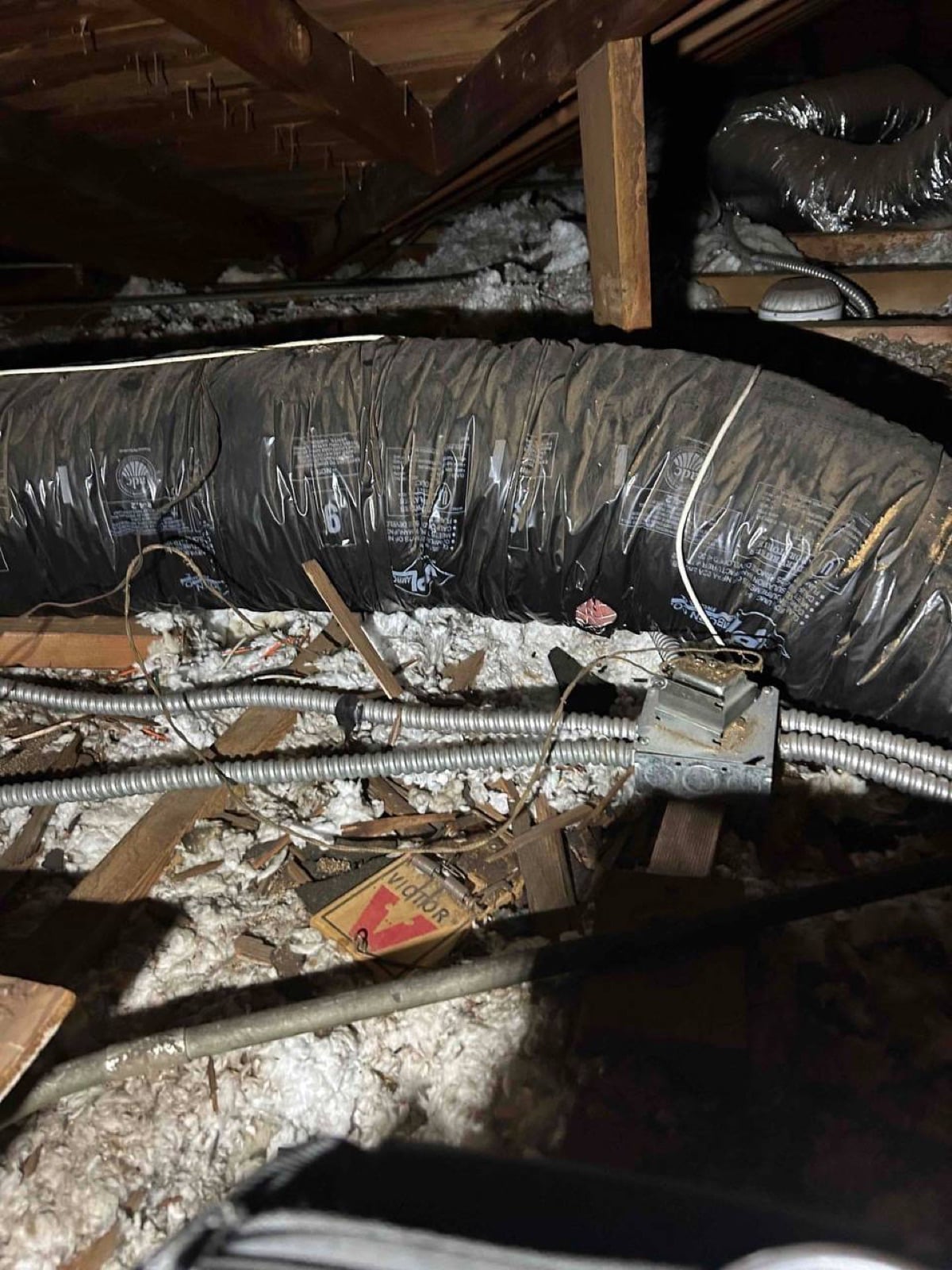 Burbank attic before work began, showing the condition the crew found