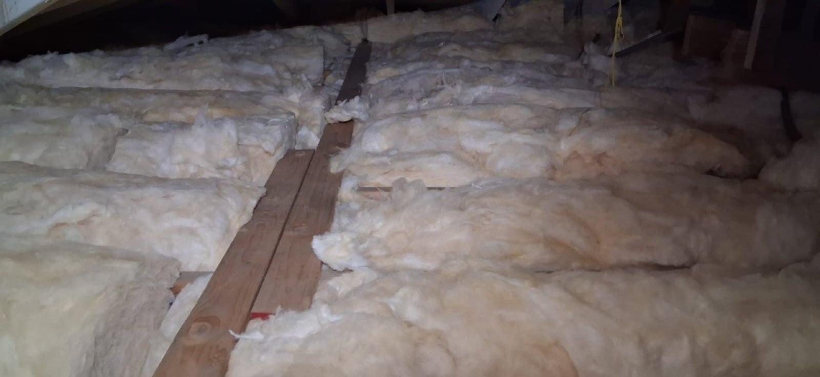 Los Angeles attic with the new insulation going in