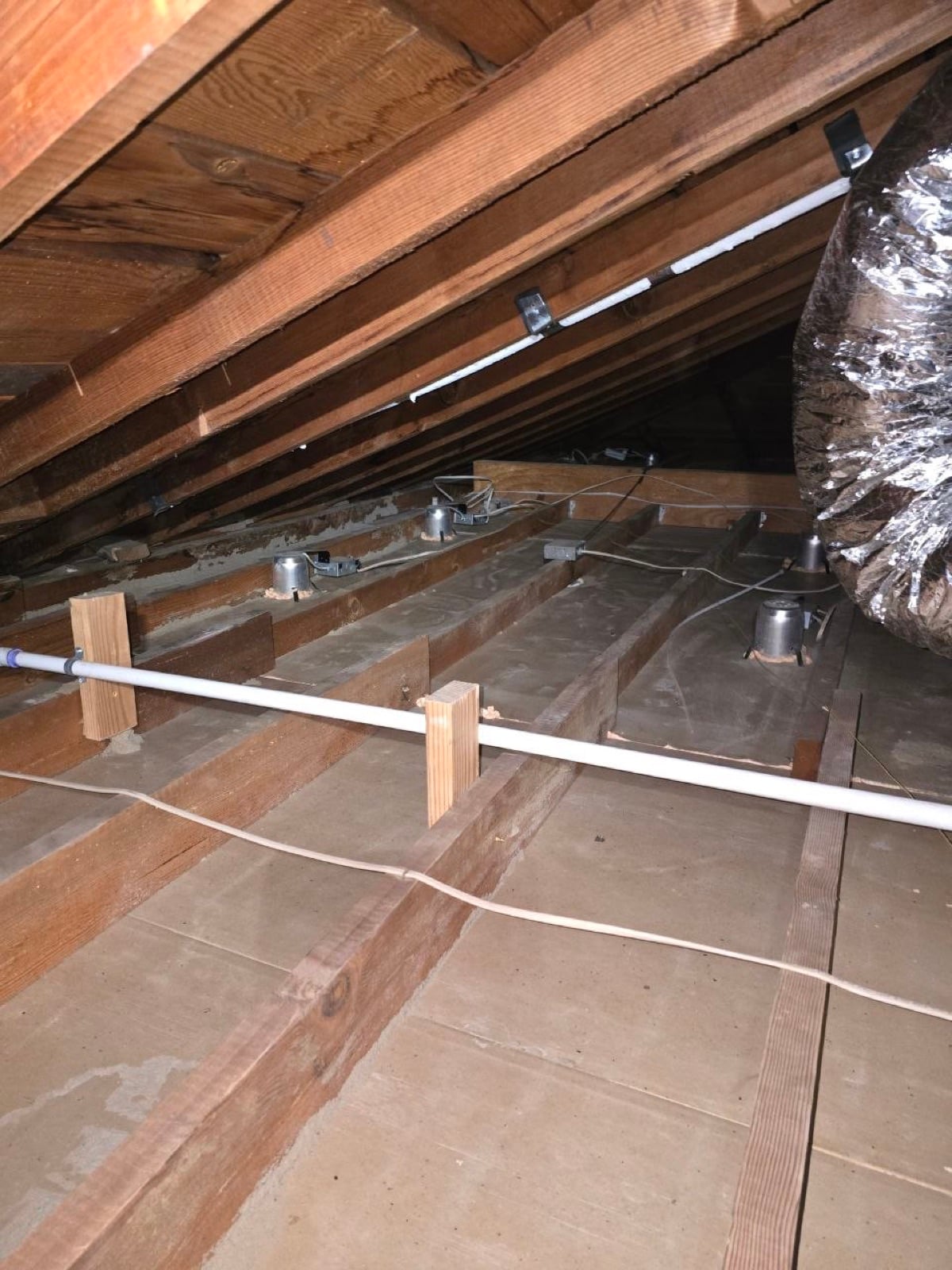 San Mateo attic before work began, showing the condition the crew found