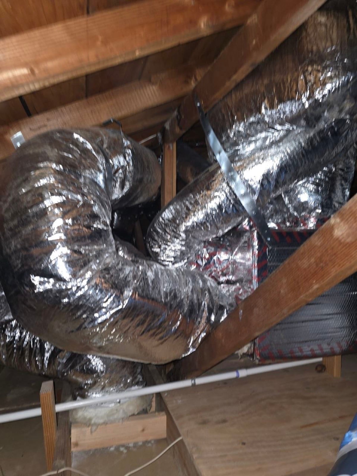 Early stage of the San Mateo attic job — clearing out