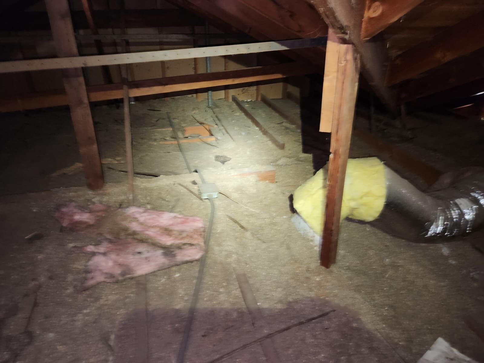 Upland attic with the last of the old insulation coming out