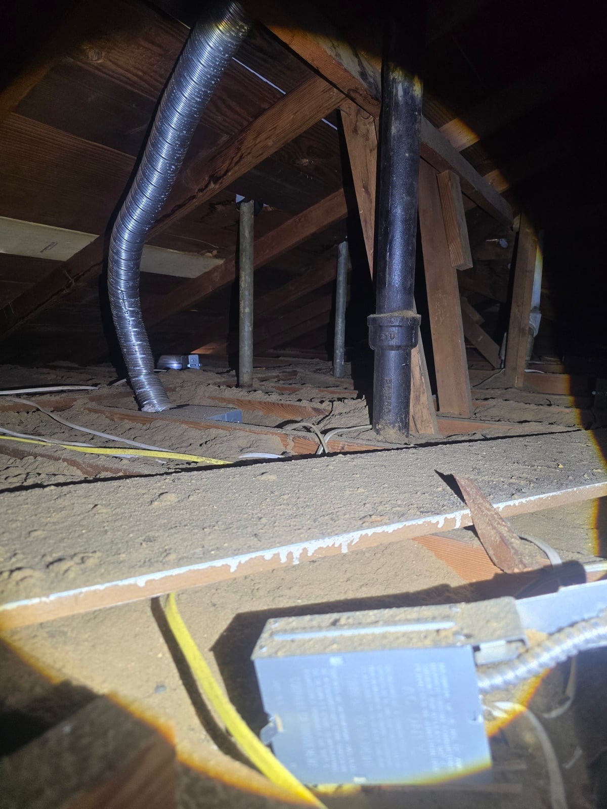 Downey attic before work began, showing the condition the crew found