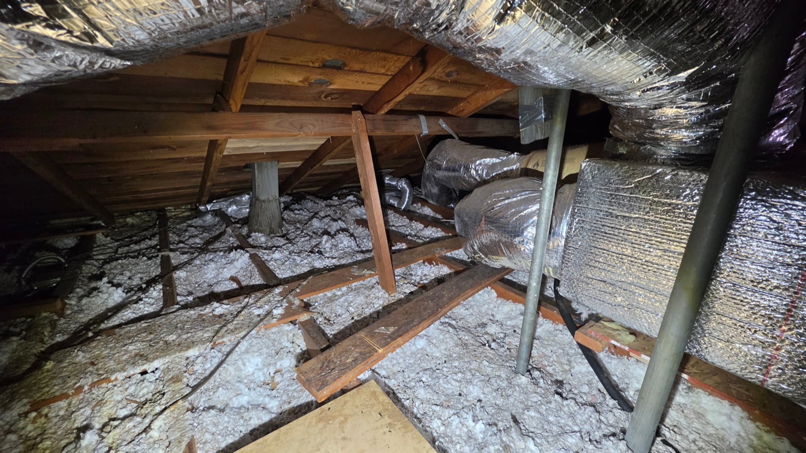 Costa Mesa attic before work began, showing the condition the crew found