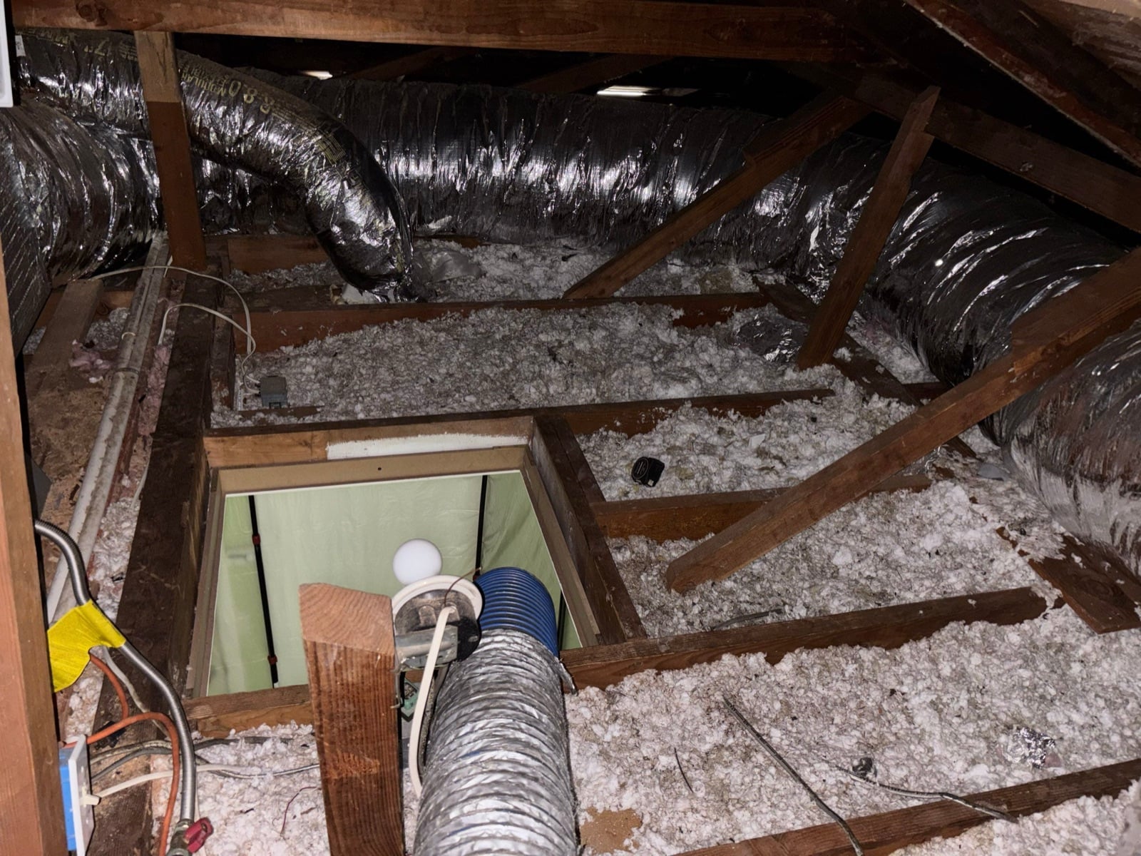 Early stage of the Costa Mesa attic job — clearing out