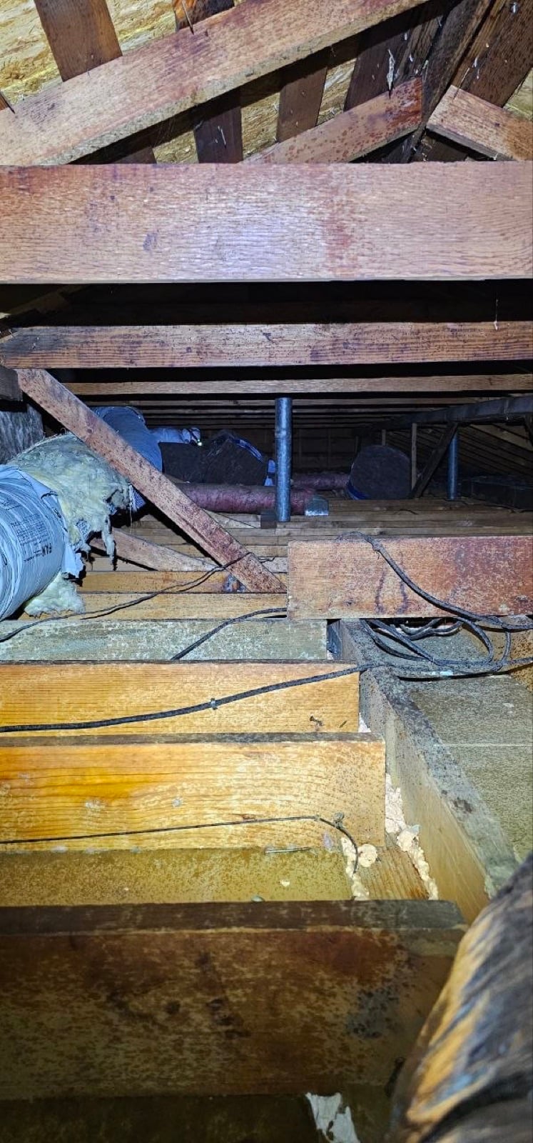 Early stage of the Sacramento attic job — clearing out