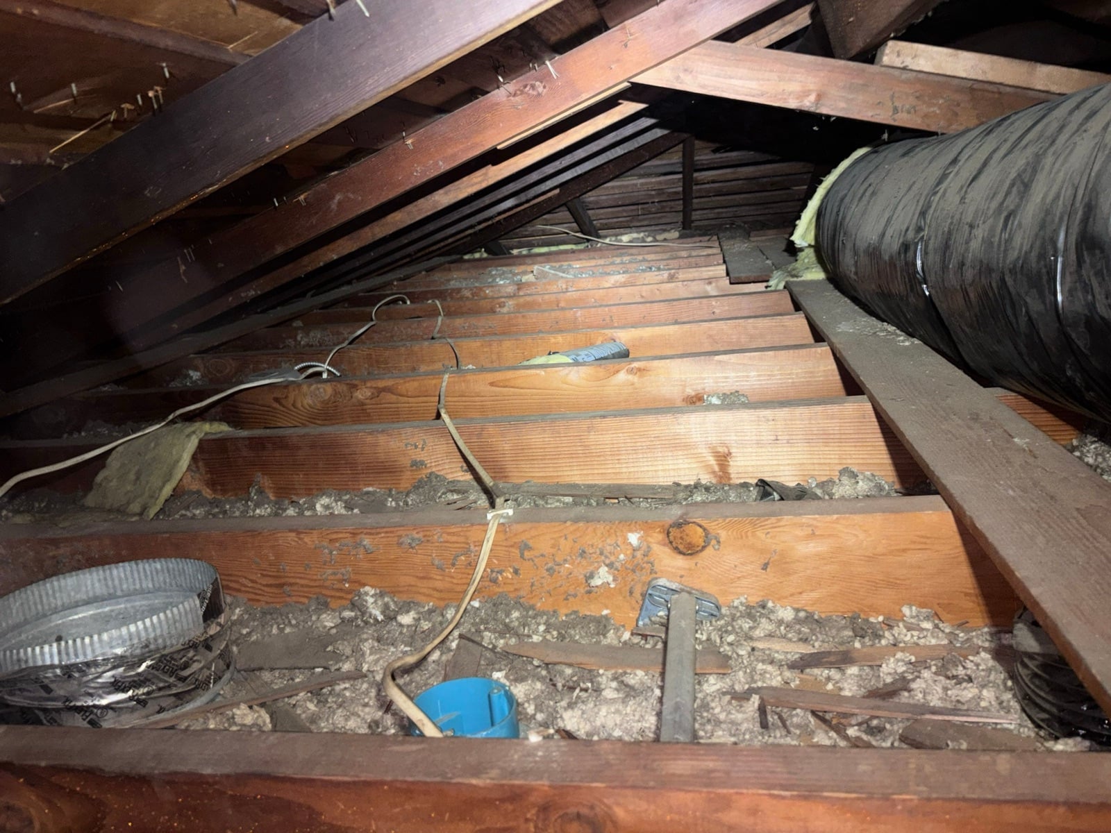 Whittier attic and crawl space before work began, showing the condition the crew found