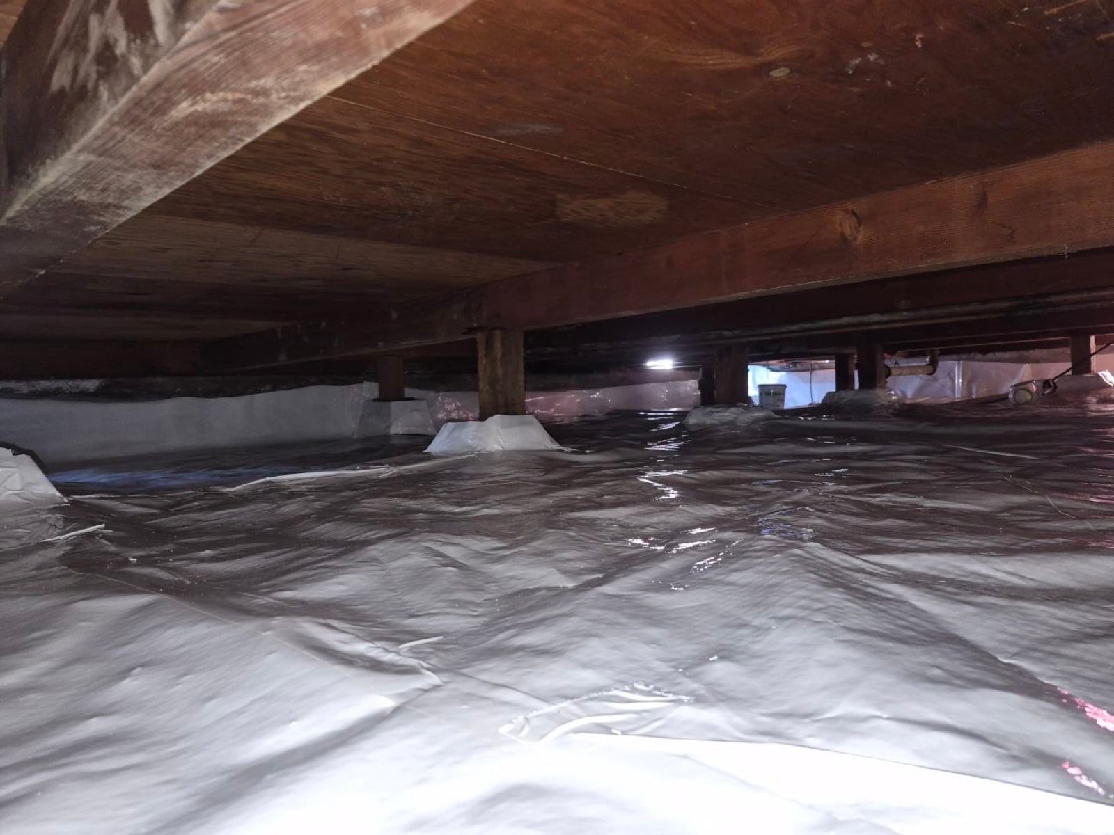 New vapor barrier going down in the Novato crawl space