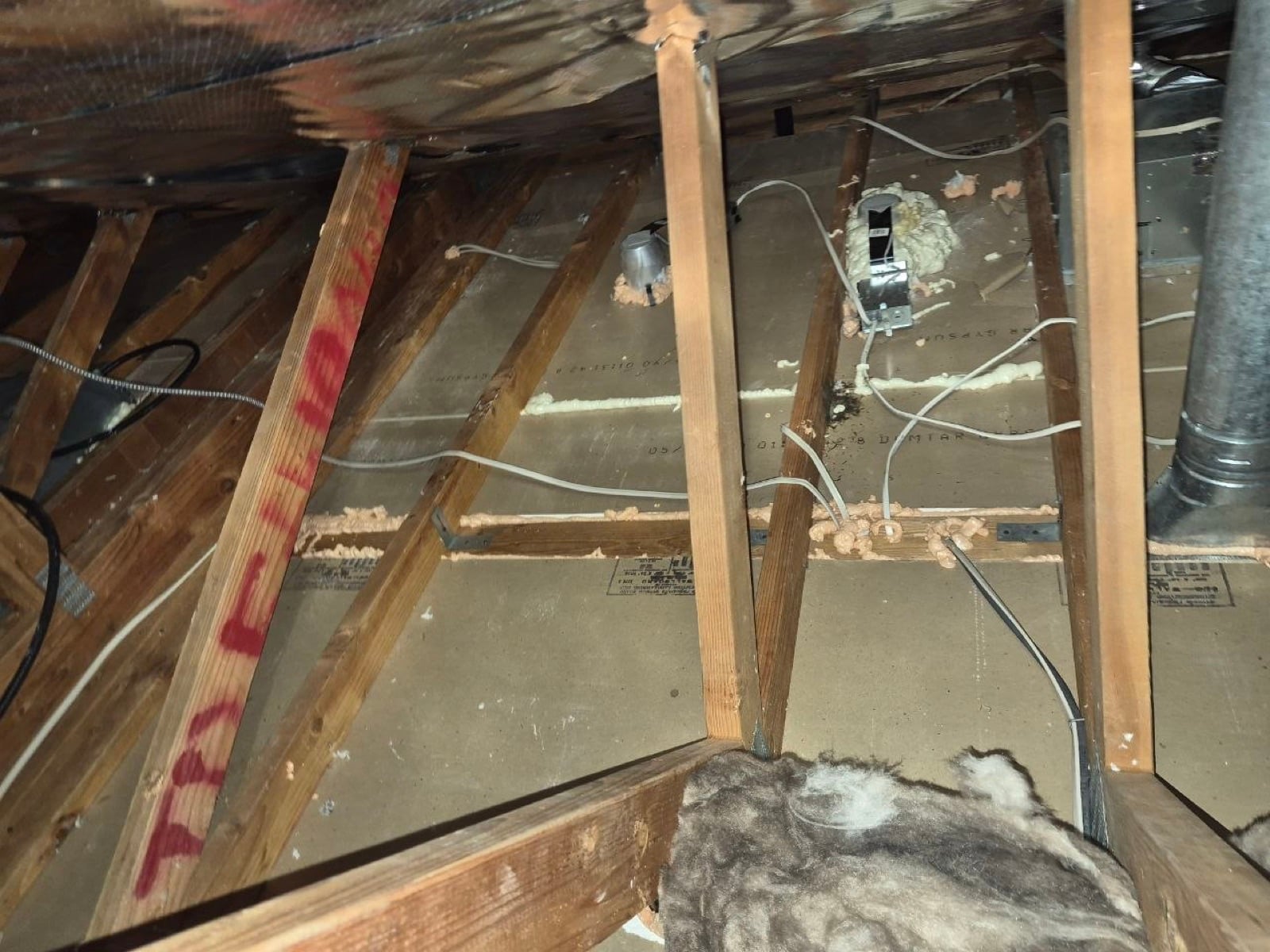 Brentwood attic before work began, showing the condition the crew found