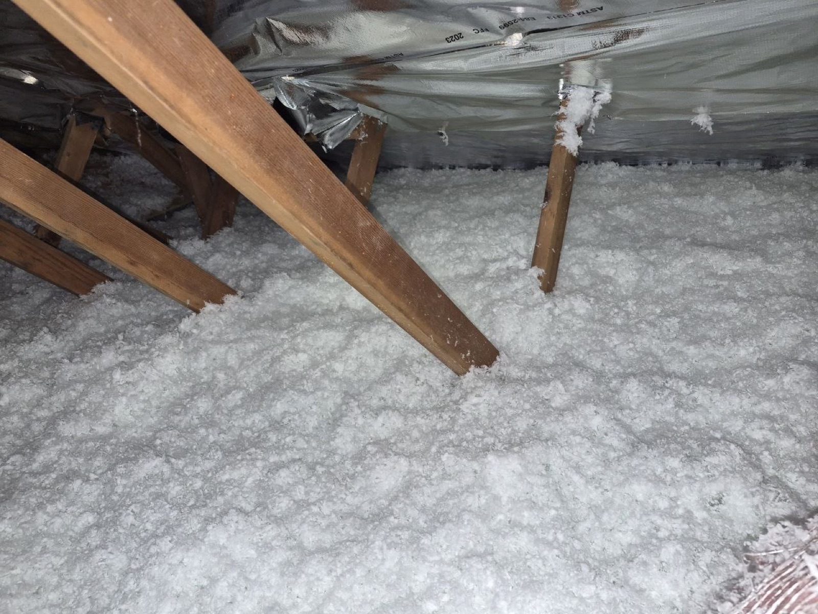 Brentwood attic before work began, showing the condition the crew found