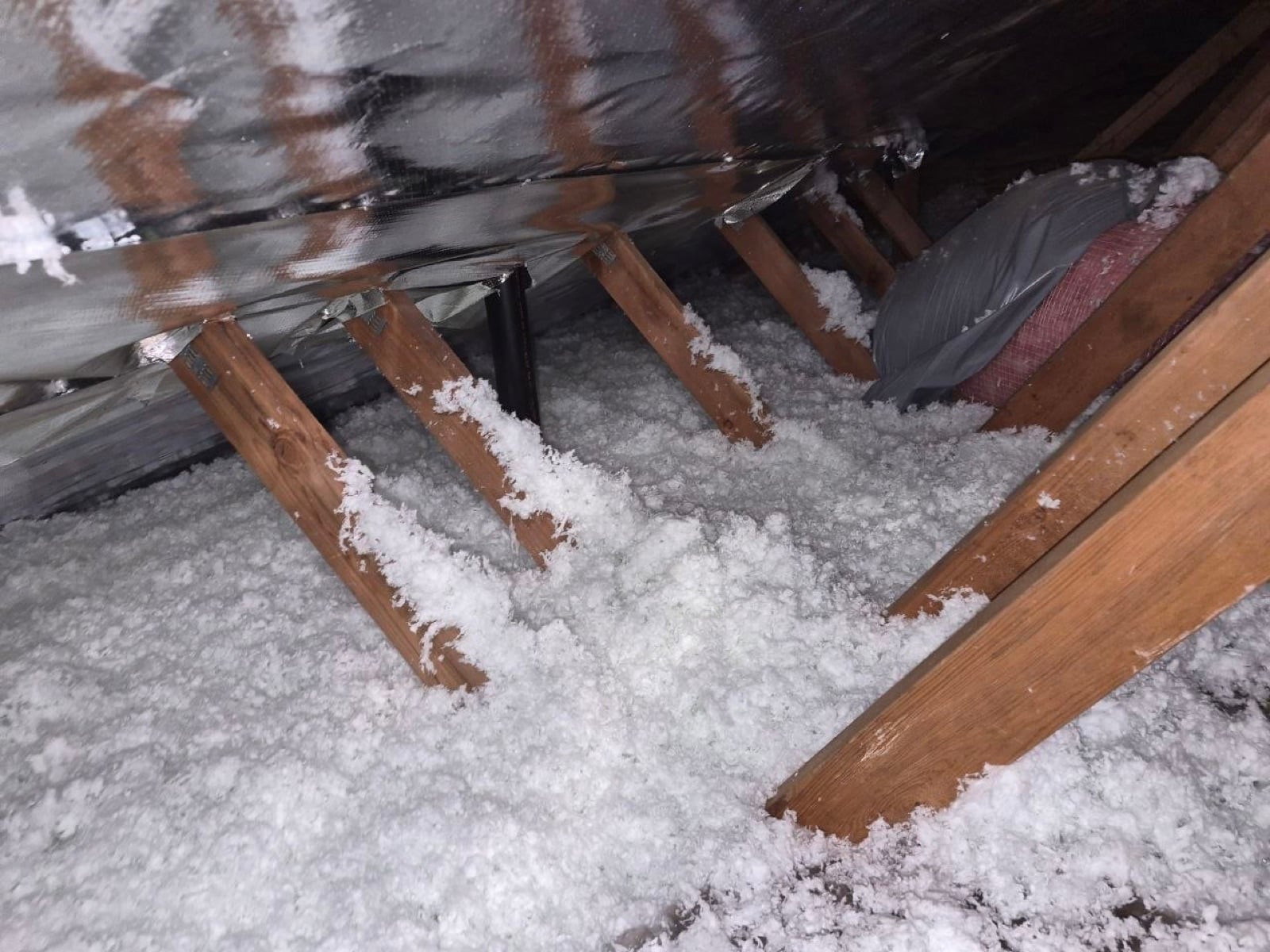 Early stage of the Brentwood attic job — clearing out