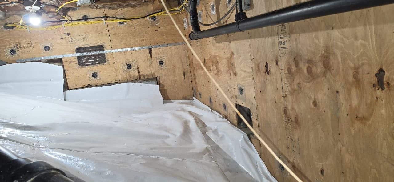 Finished Berkeley crawl space with the vapor barrier sealed at the perimeter