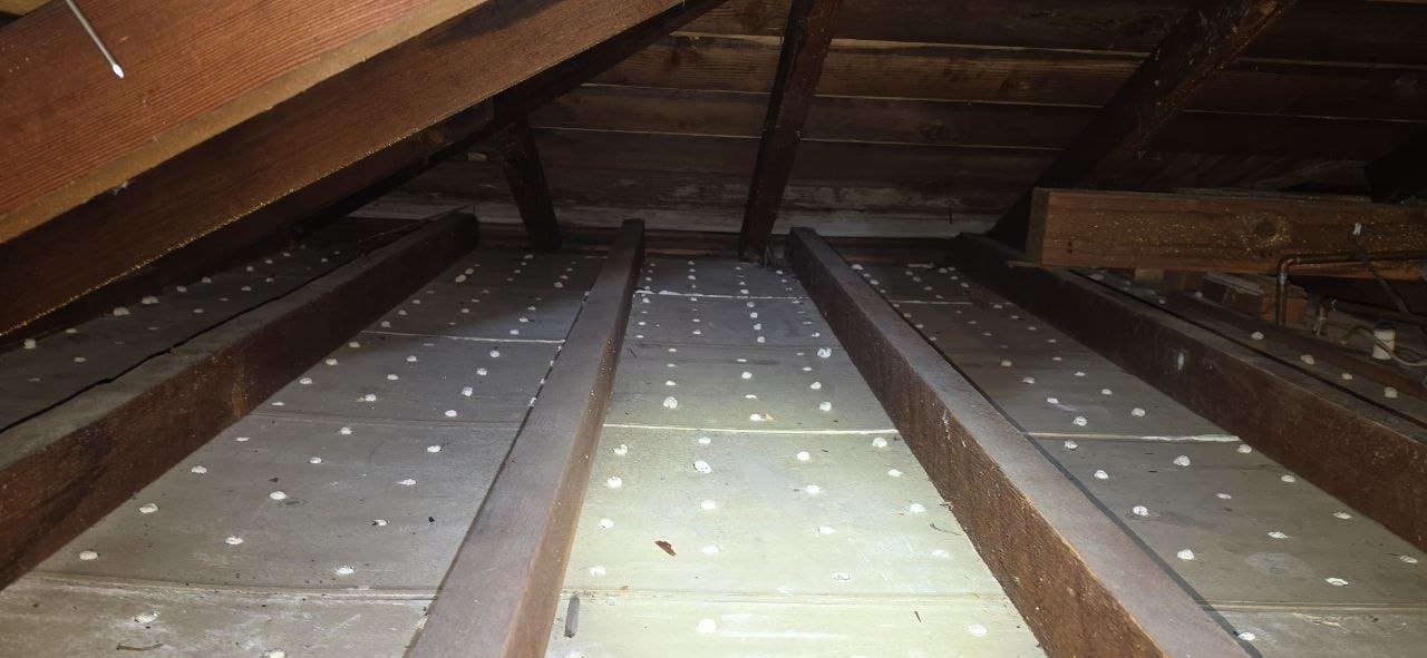 Berkeley attic after the old insulation was removed and the deck cleaned