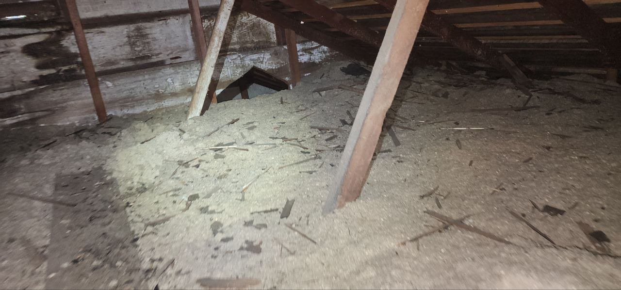 Berkeley attic before work, old insulation and debris