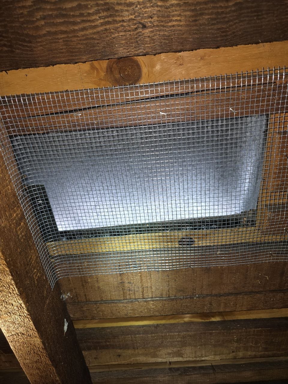Attic vent screened with wire mesh in Berkeley