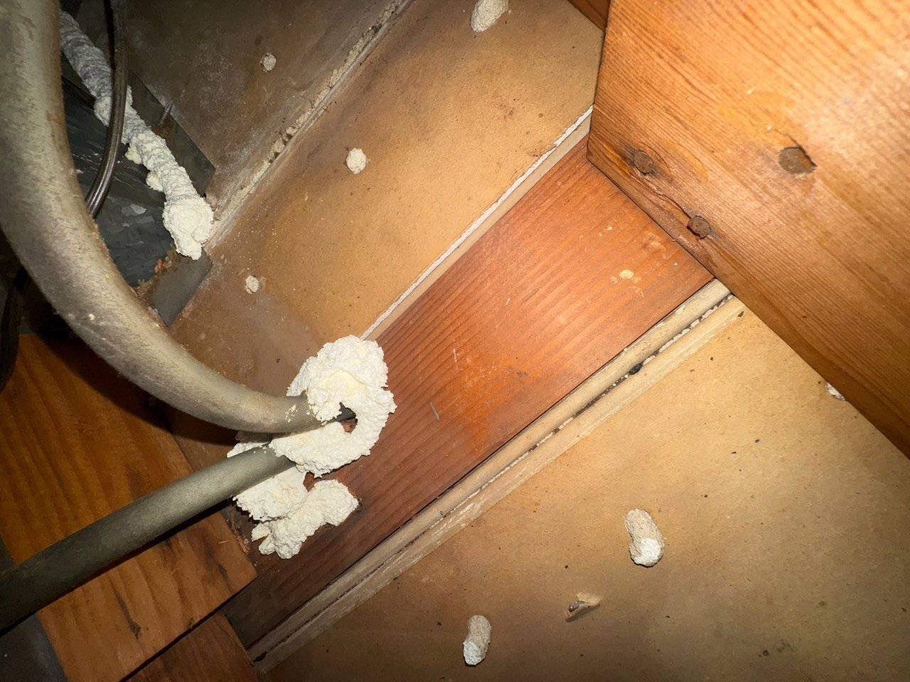 Foam air sealing around an attic penetration in Burbank