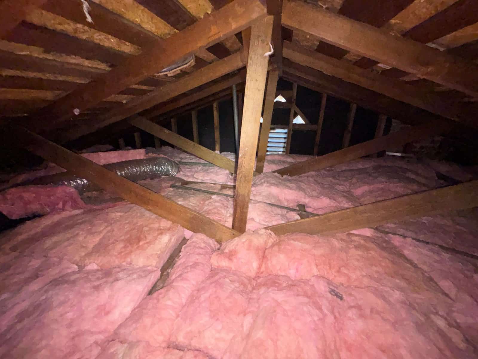 New insulation laid around ducts in a Burbank attic