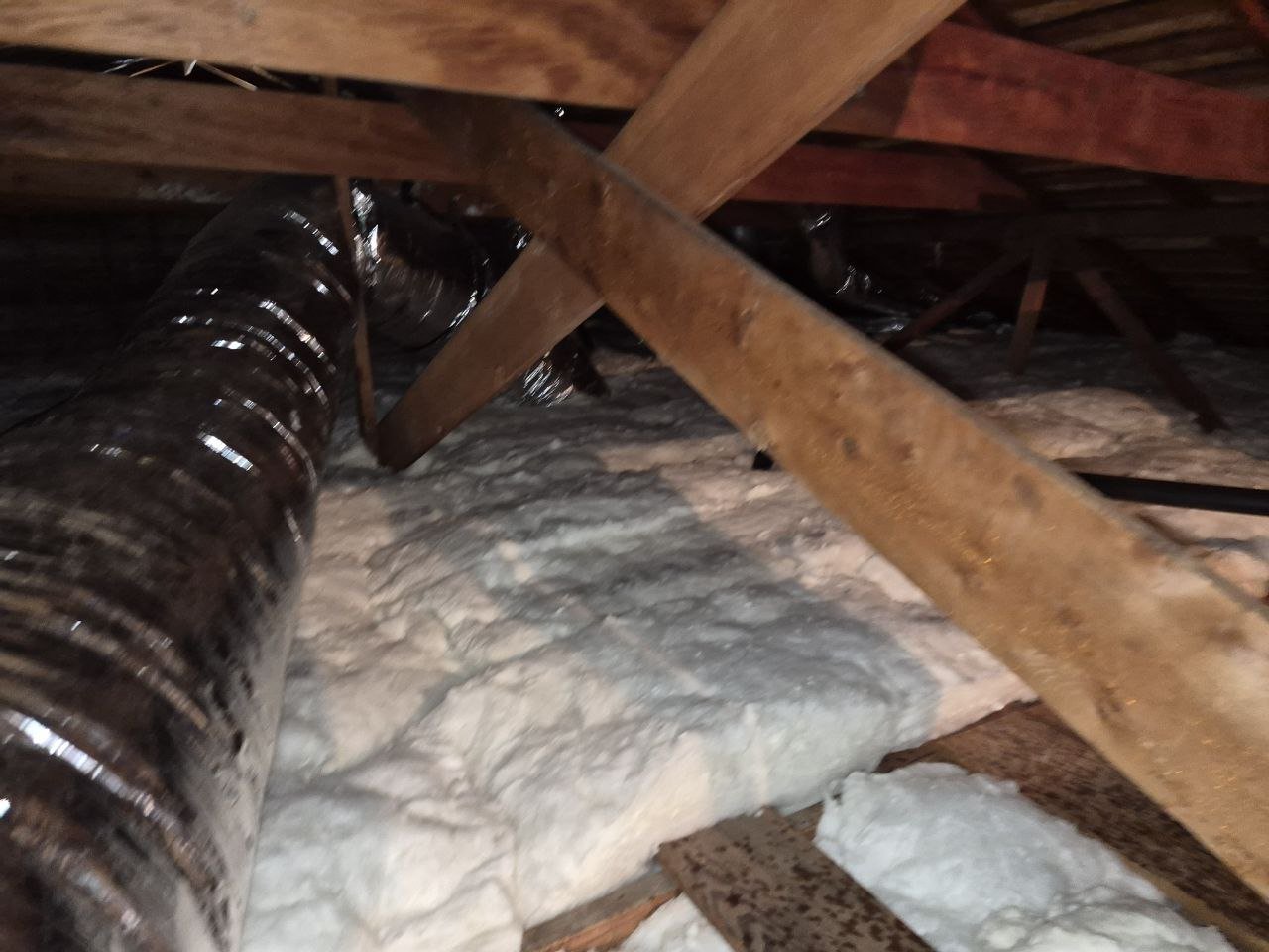 New insulation laid around ducts in a Concord attic