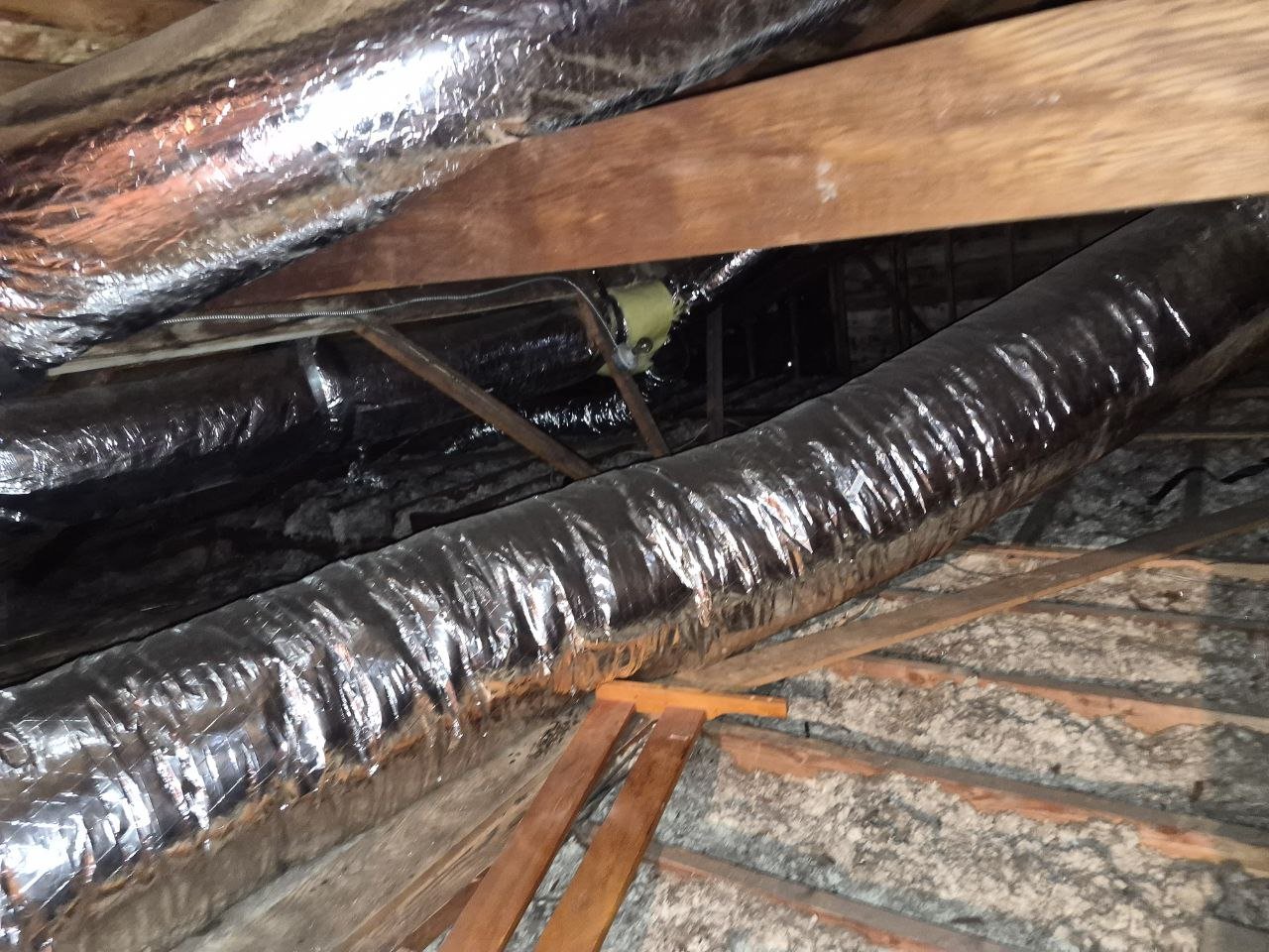 Another area of old insulation in the Concord attic before work