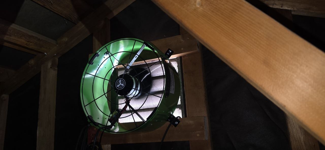 New attic fan in the gable wall of a Concord attic