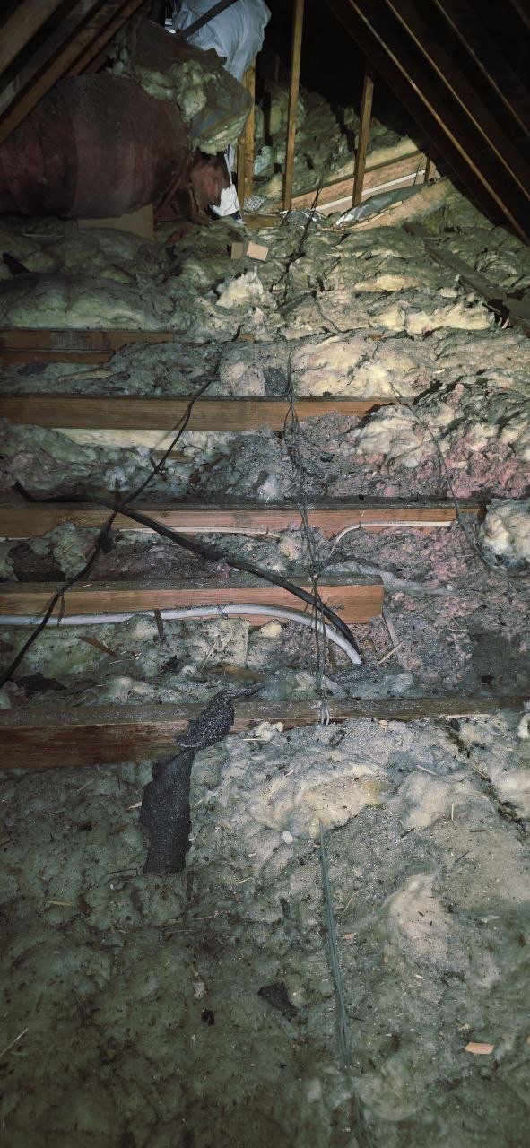 Another area of old insulation in the Danville attic before work