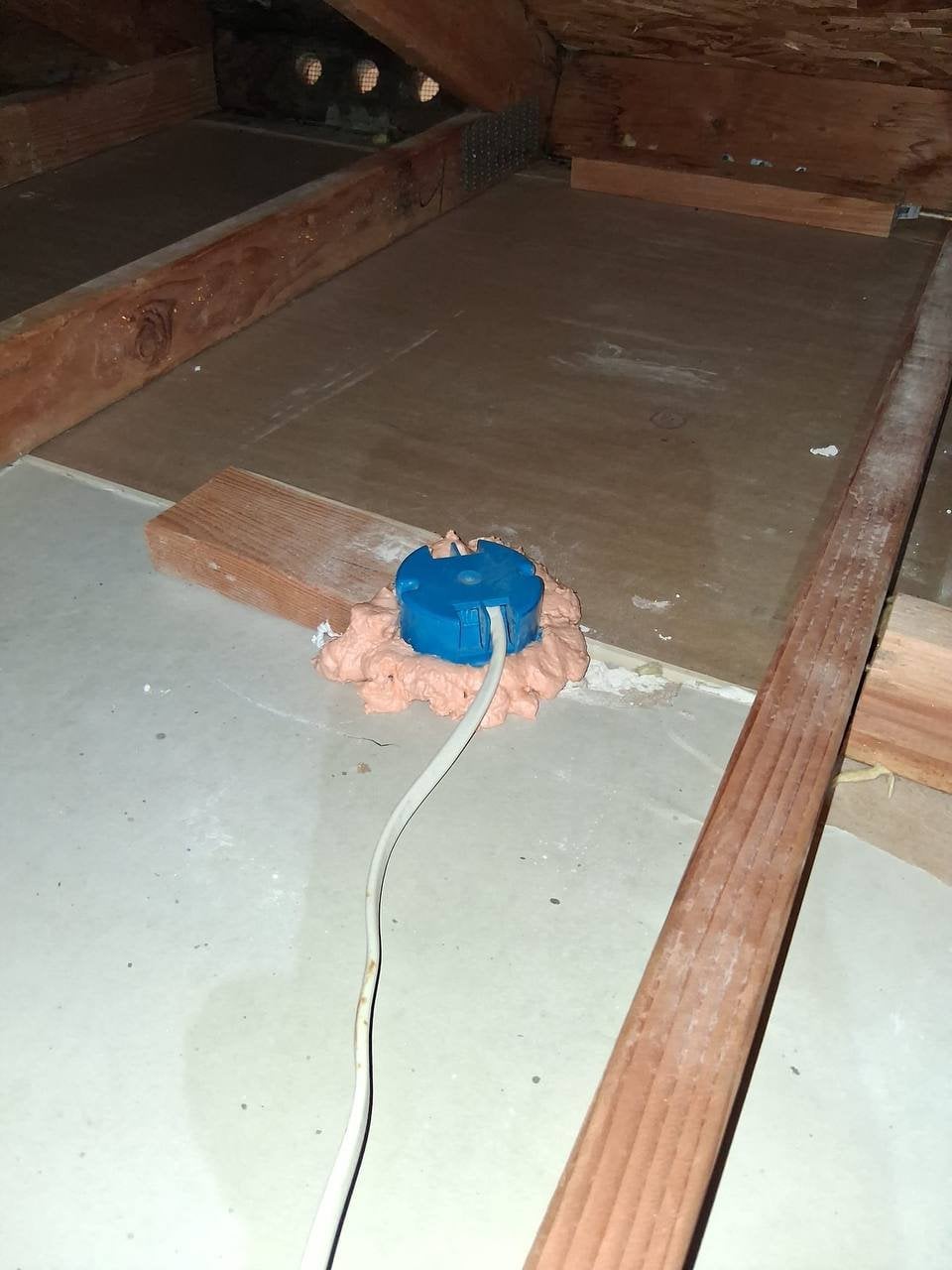 Foam air sealing around an attic penetration in Danville