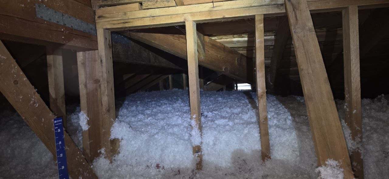 New blown-in insulation between attic framing in Fremont