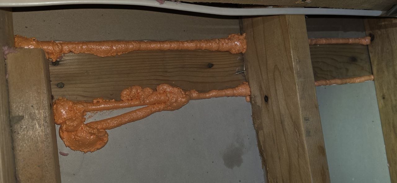 Polyurethane foam air sealing along attic framing in Fremont