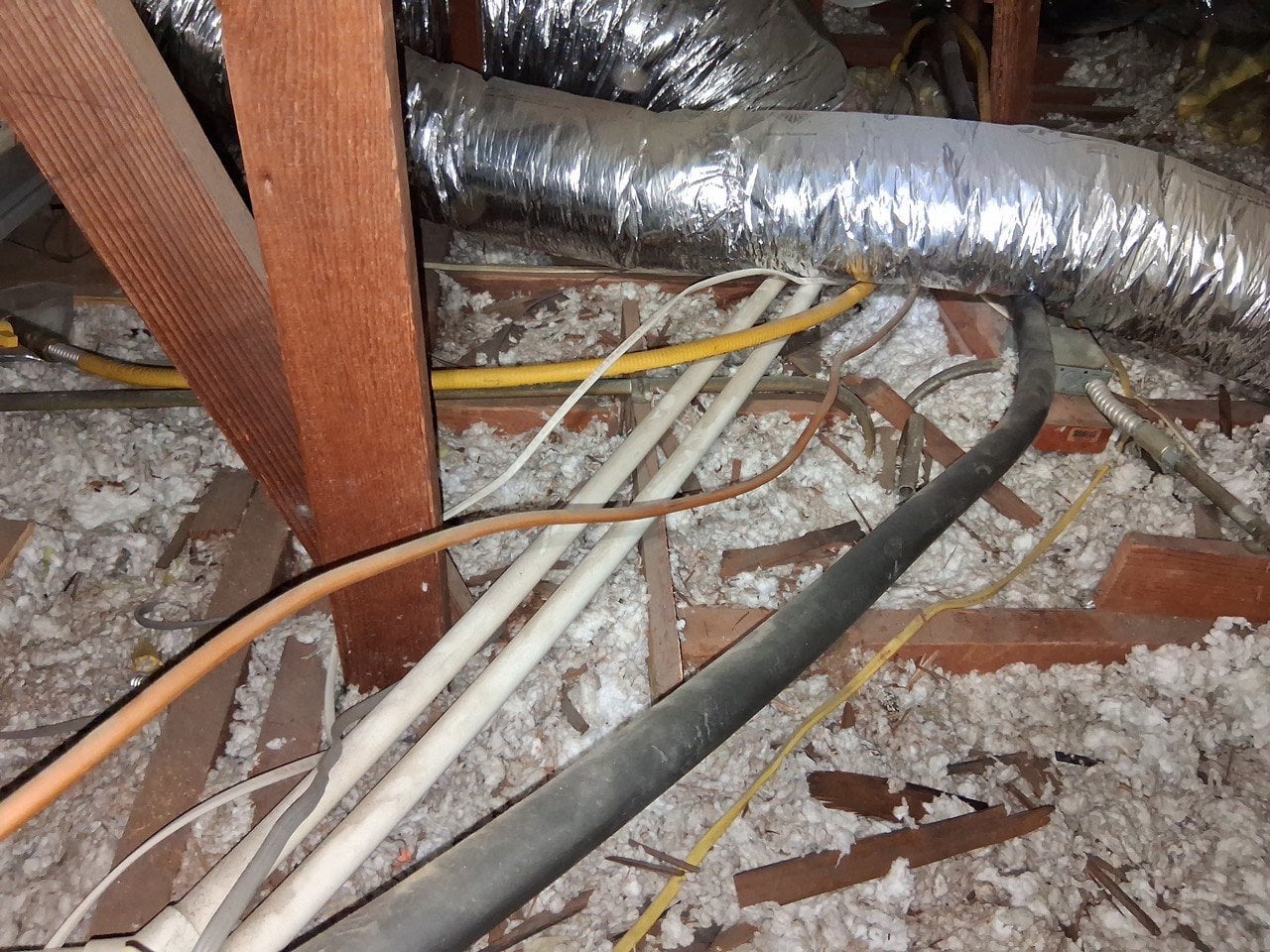 Glendale attic before work, old insulation and debris