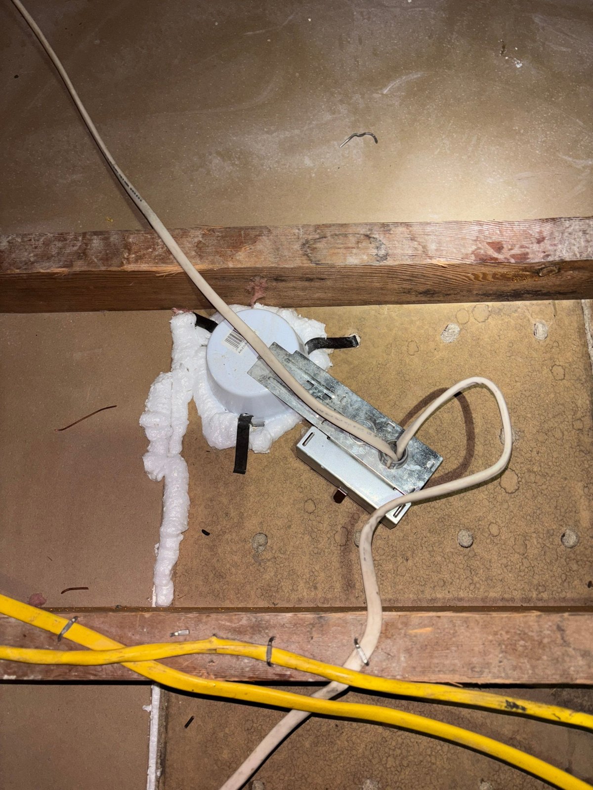 Foam air sealing around an attic penetration in Glendale