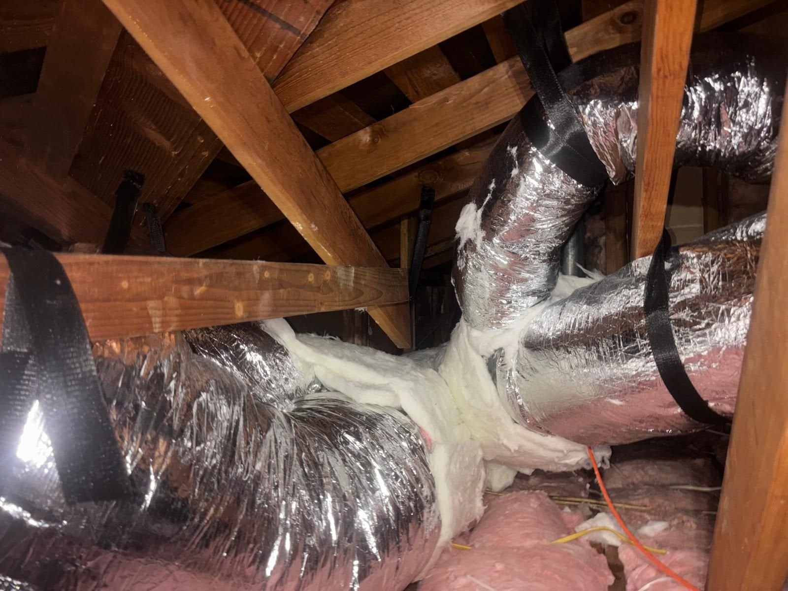 New flexible air duct runs in a Hacienda Heights attic