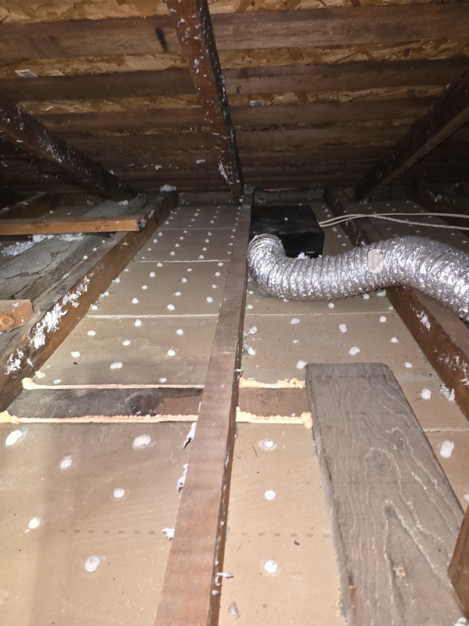 Polyurethane foam air sealing along attic framing in Hayward