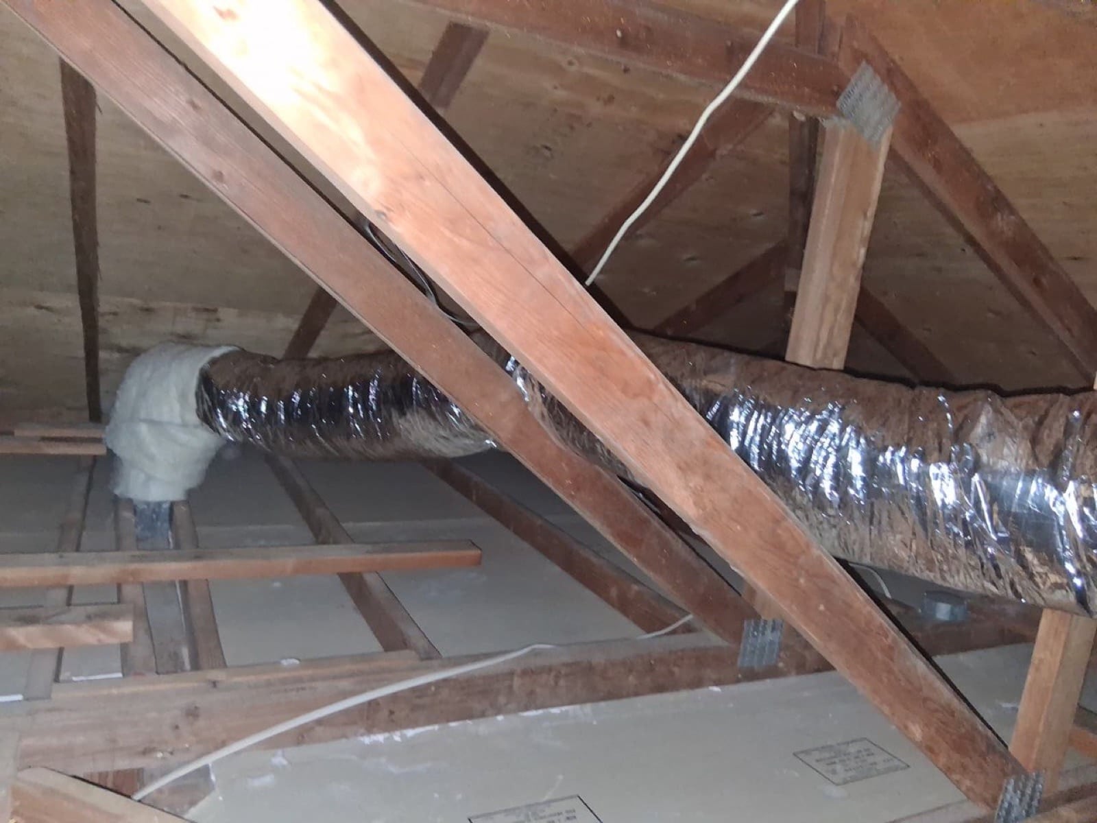 Calabasas attic with the new air ducts run through the framing