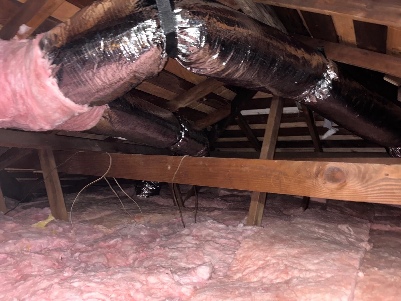 New flexible air ducts over new insulation in a Long Beach attic