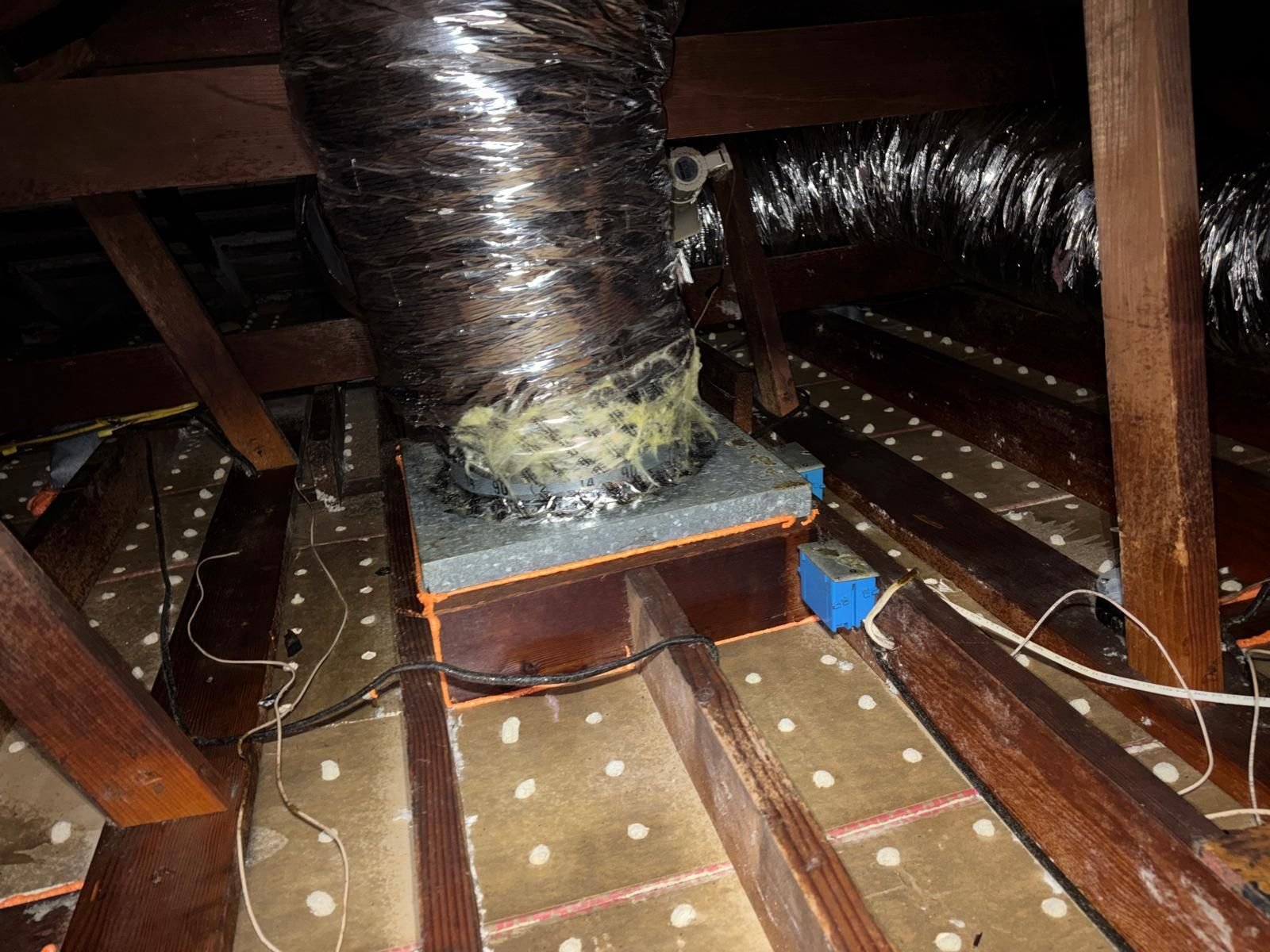 Cleaned attic deck around an air duct connection in Long Beach