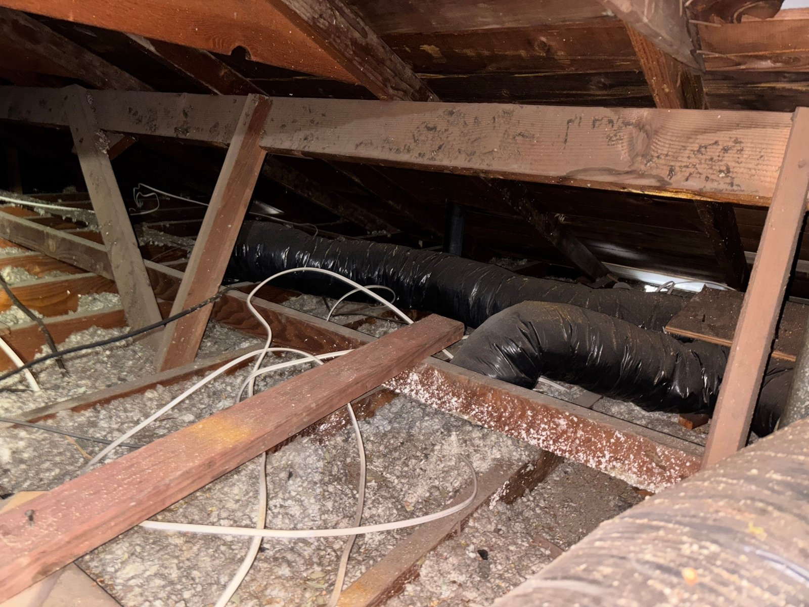 Long Beach attic before work, old insulation
