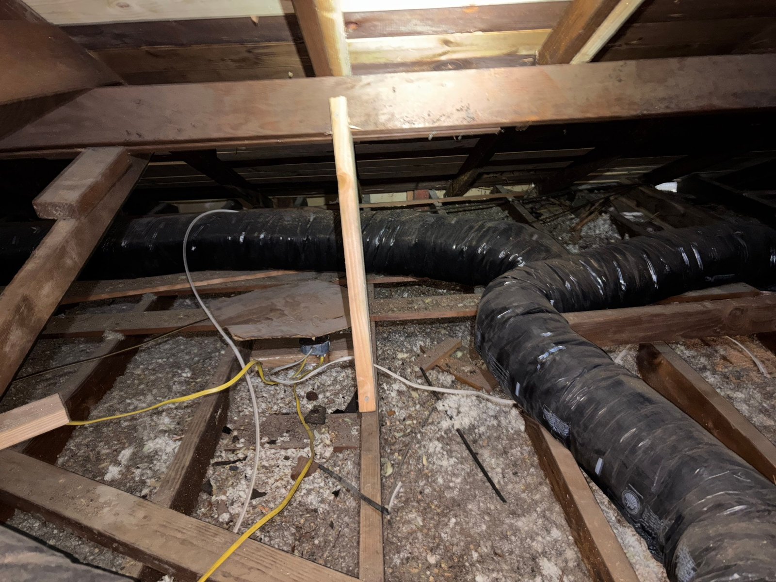 Another area of old insulation in the Long Beach attic before work