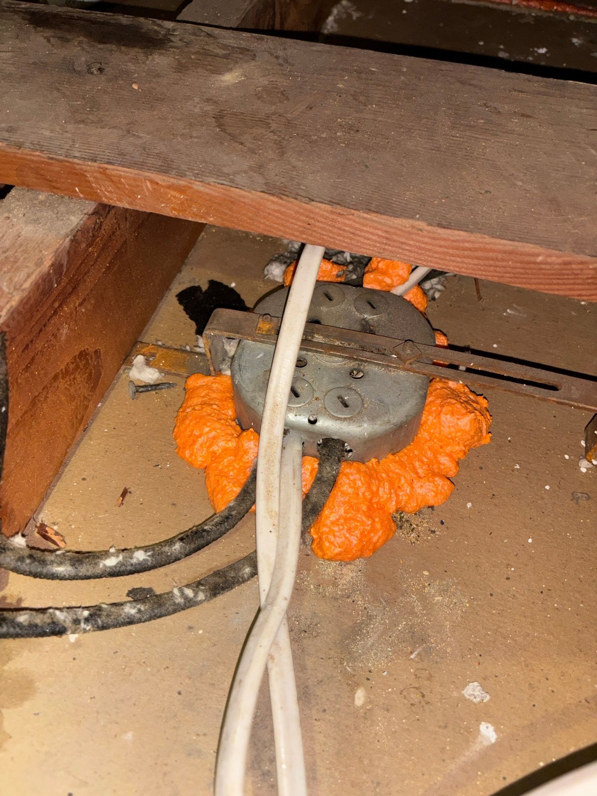 Foam air sealing around an attic penetration in Long Beach