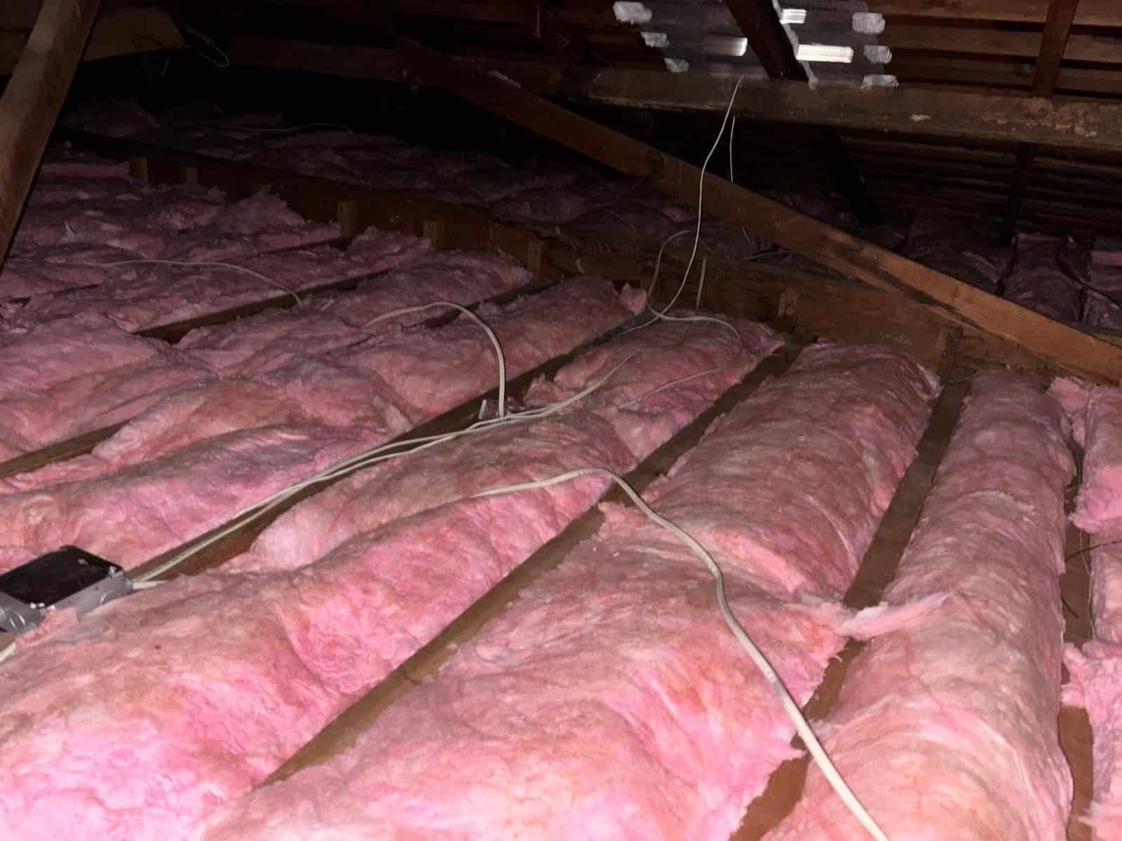 New insulation laid around ducts in a Long Beach attic
