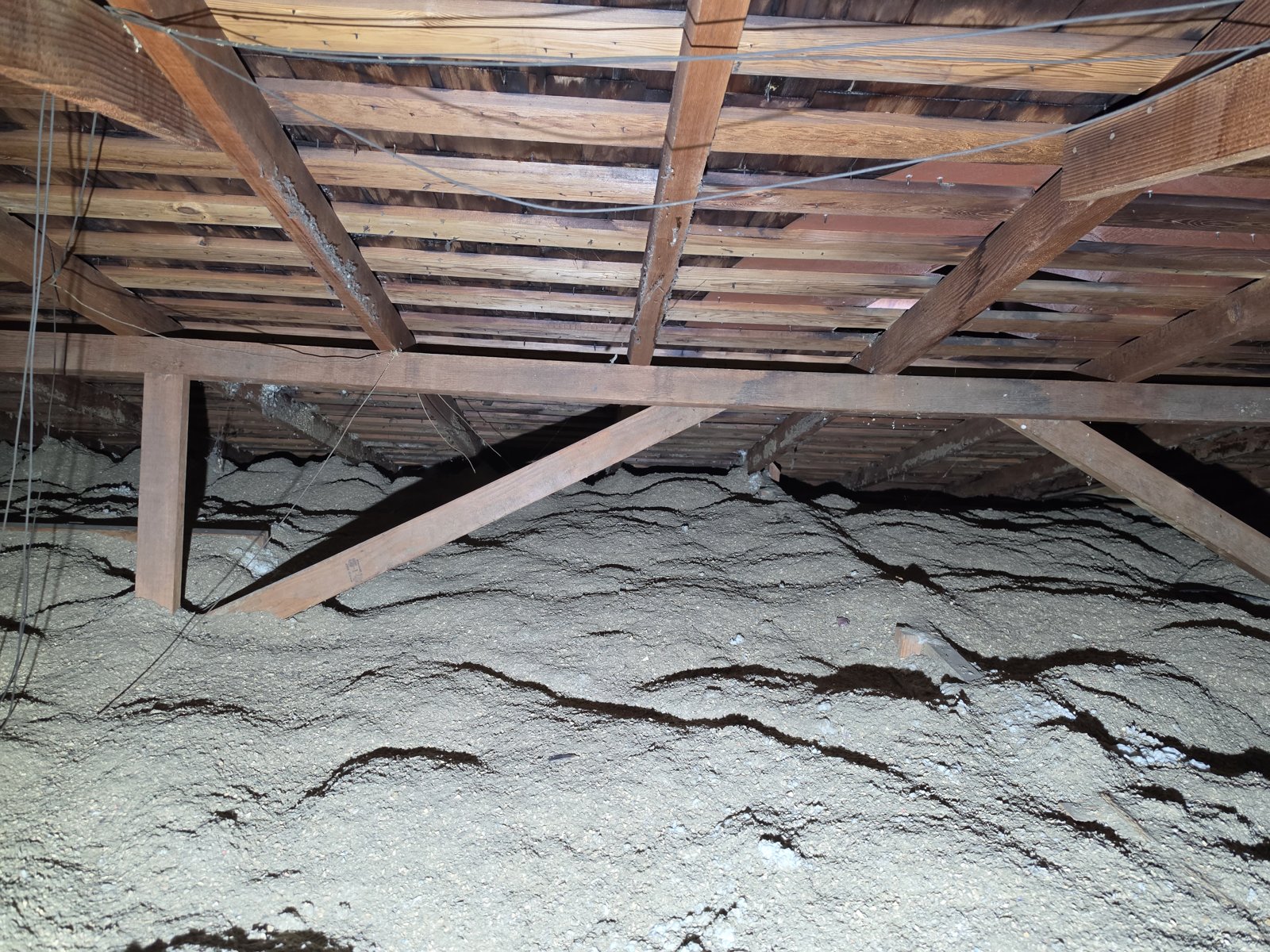 Long Beach attic before work, old insulation