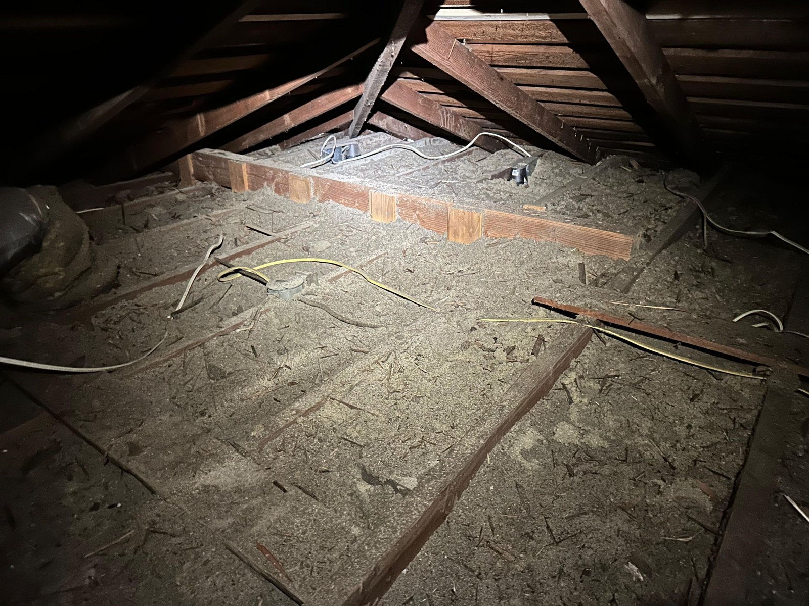 Long Beach attic before work, old insulation
