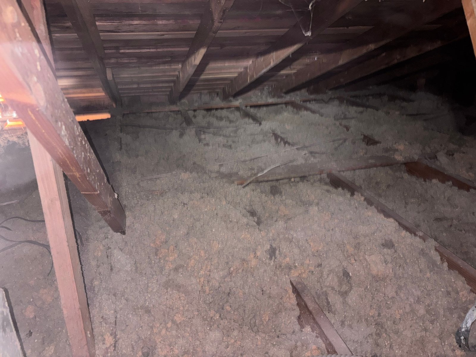 Long Beach attic before work, old insulation