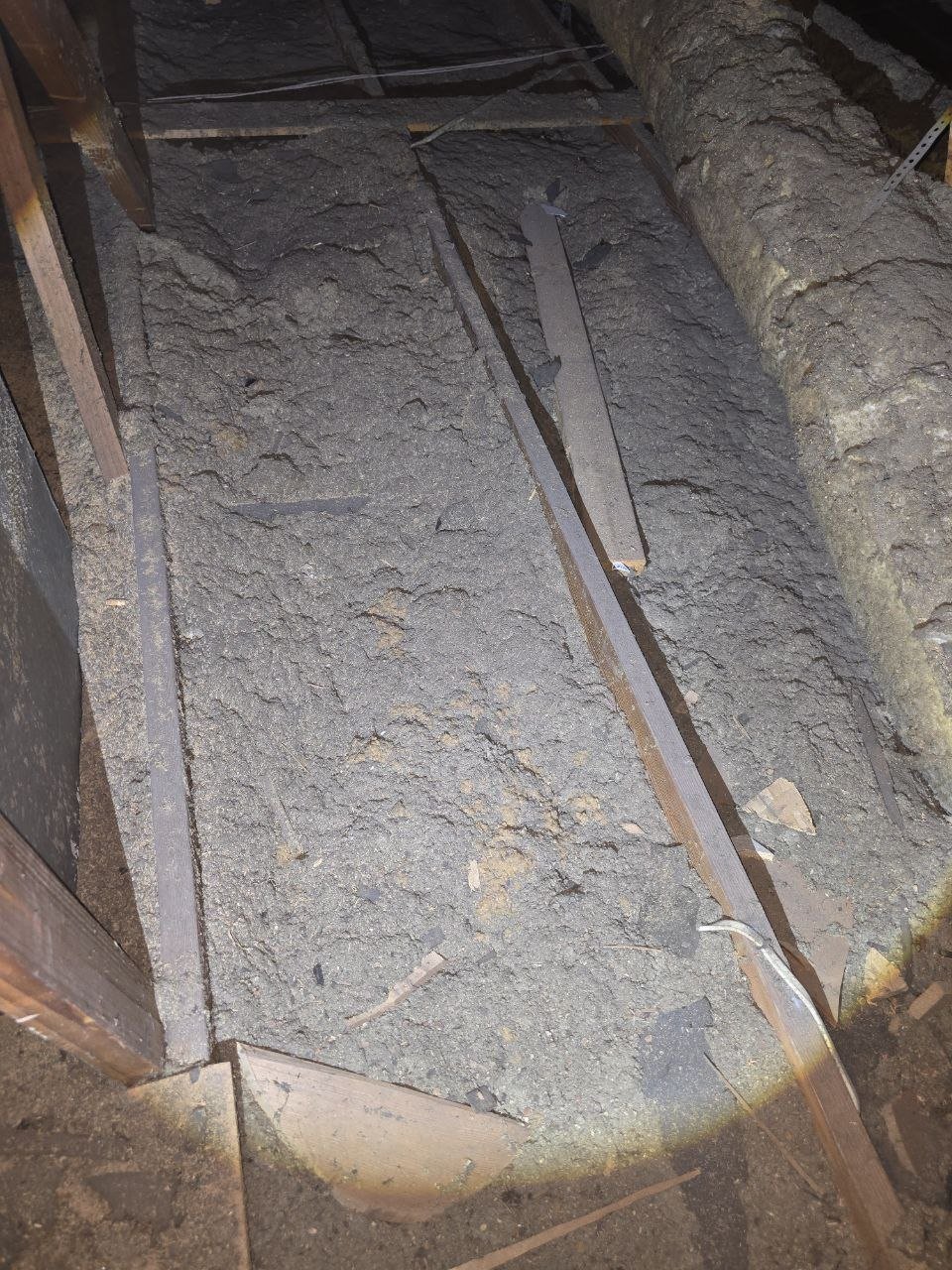 Another area of old insulation in the Long Beach attic before work