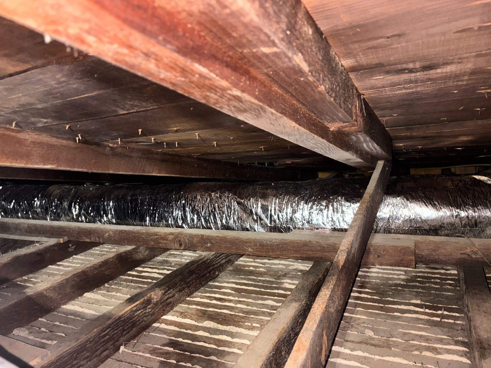 New flexible air duct runs in a Long Beach attic