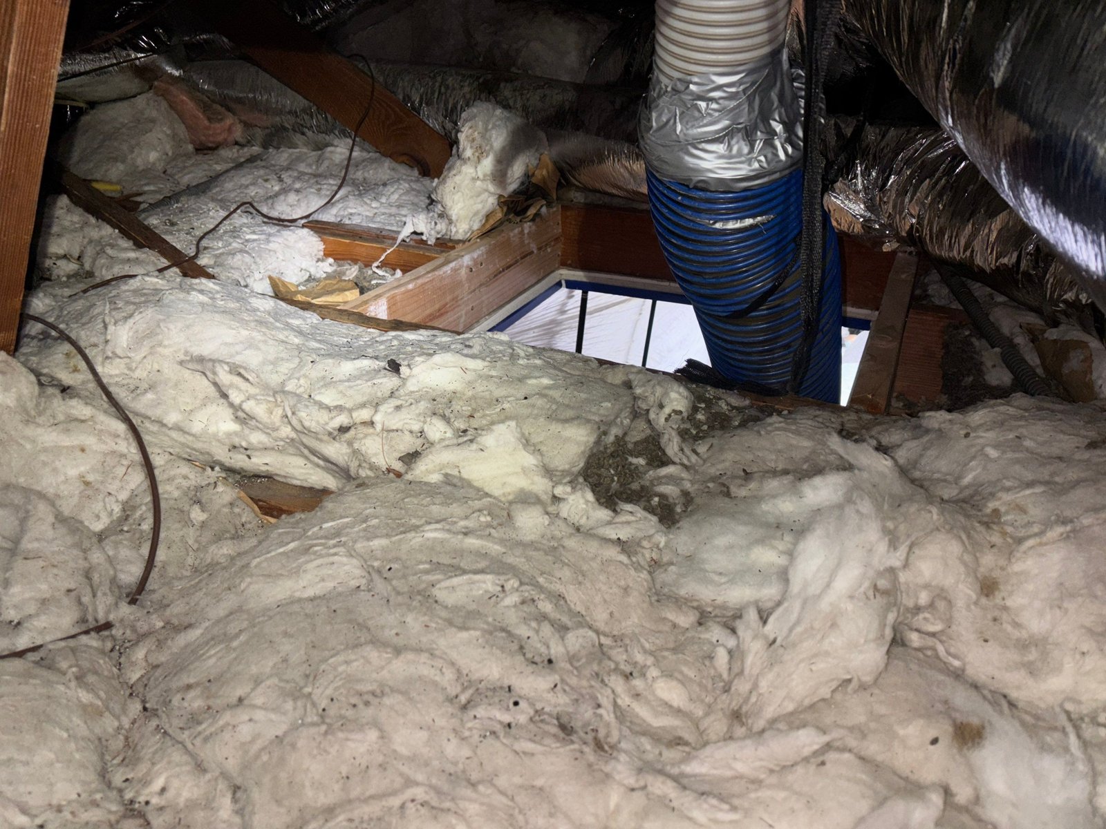Another area of old insulation in the Los Angeles attic before work